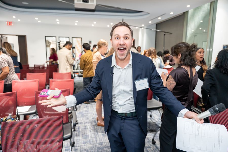 A TechChange facilitator welcoming the room