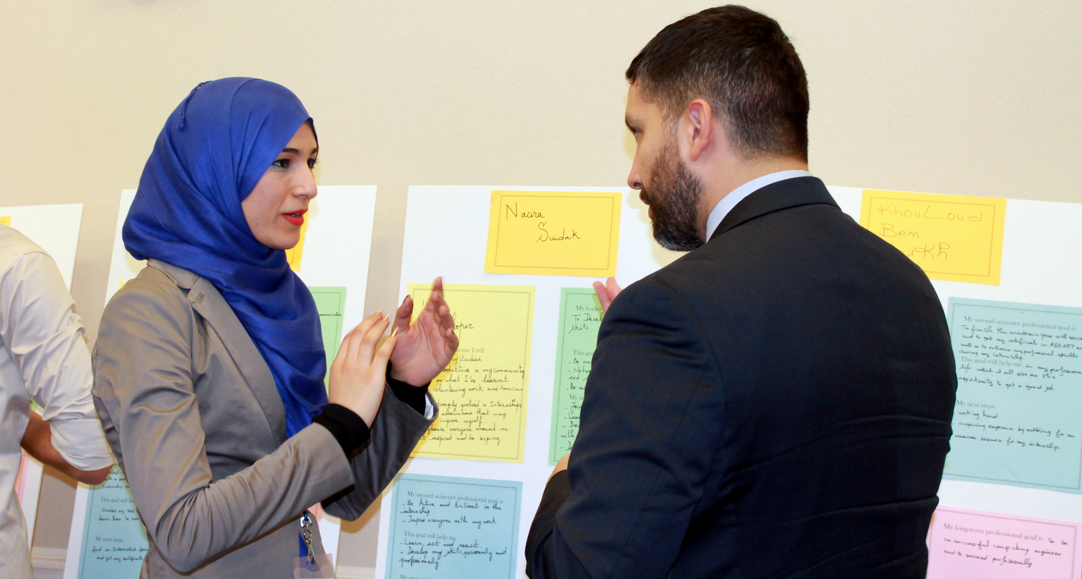 Picture of discussion during poster session at IREX