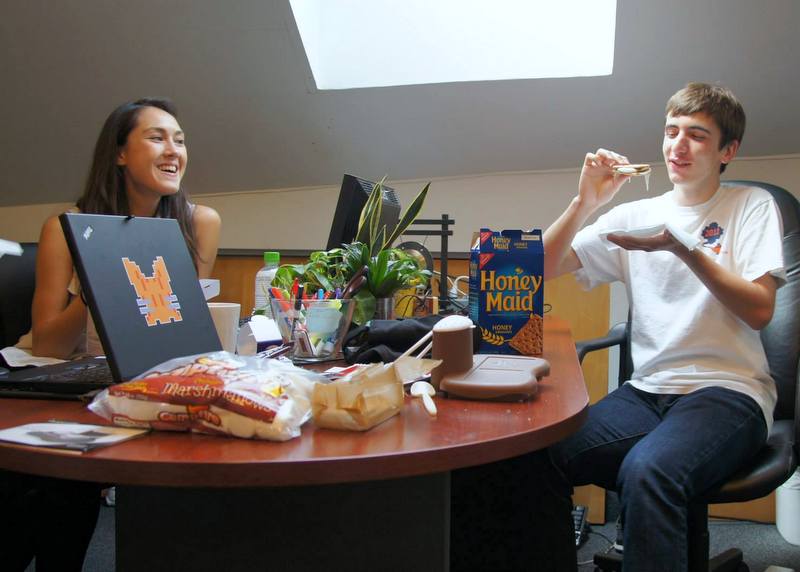 TechChange staff making and eating smores.