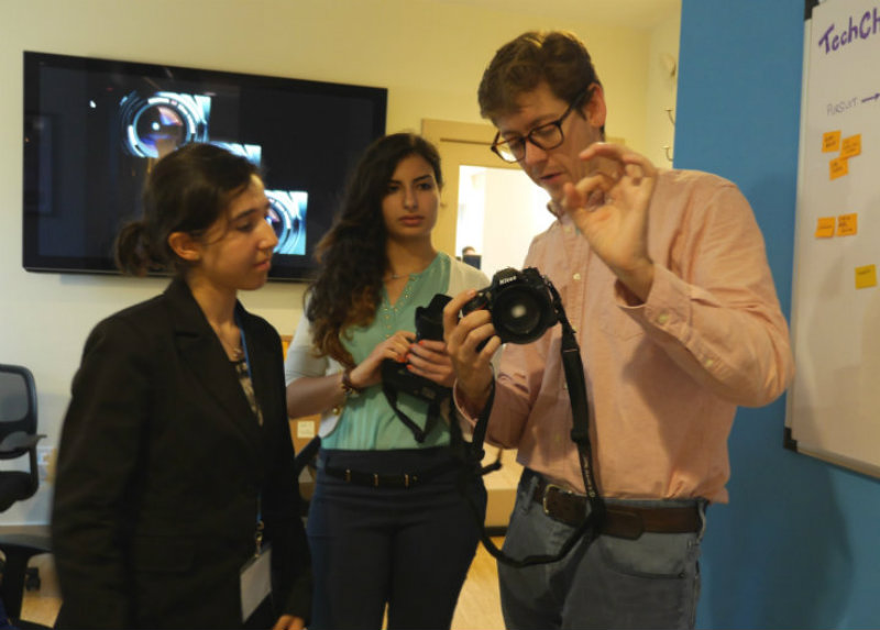 TechGirls Ghada and Nataly   learn about photography with Charlie during their visit to the TechChange office