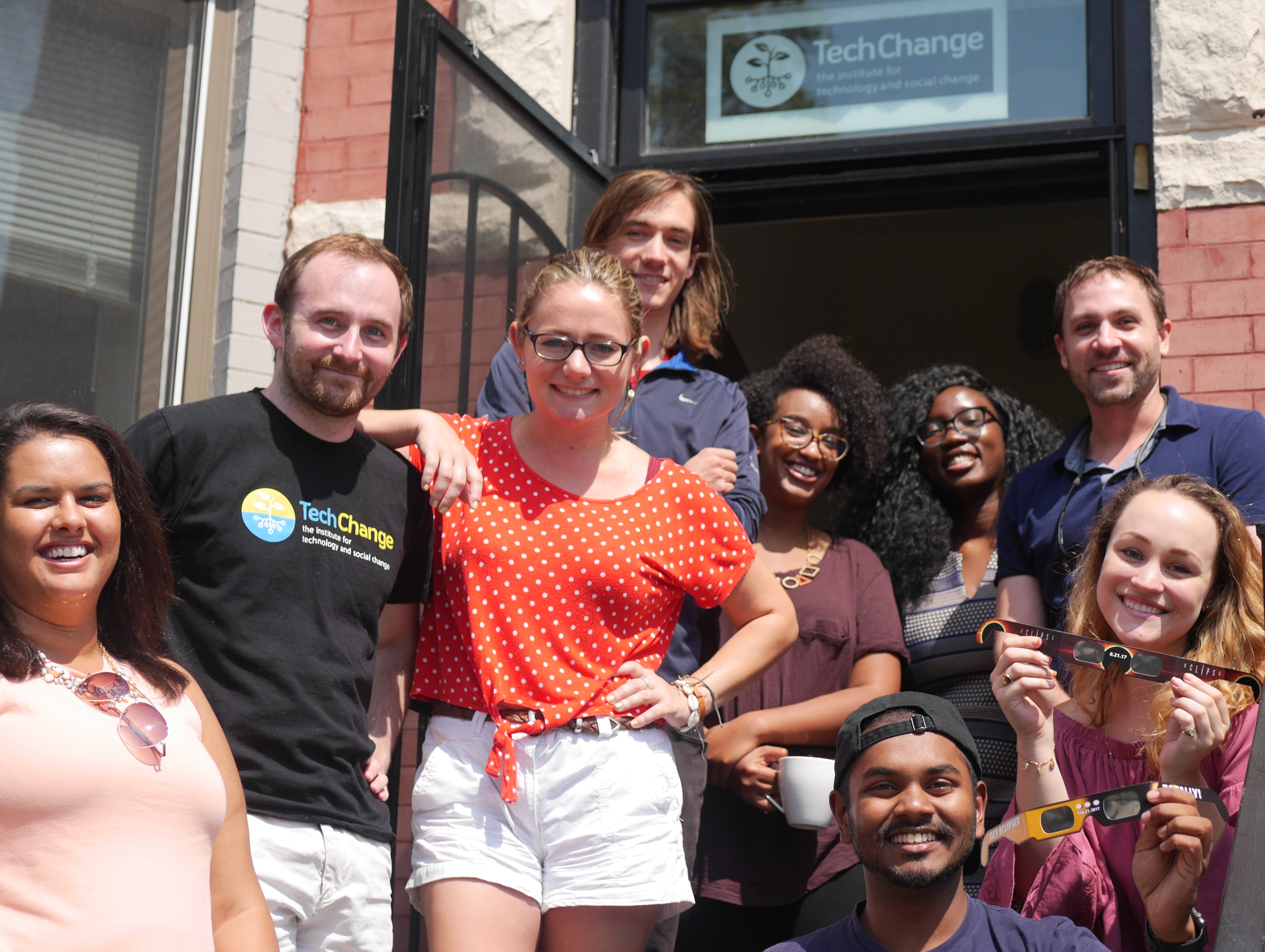 TechChange team watching the eclipse this past August from our office!
