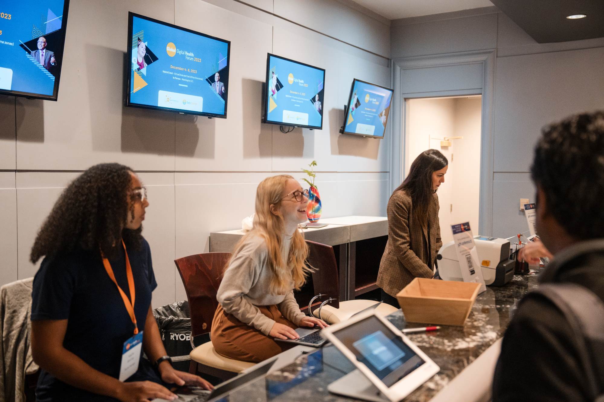 registration desk with staff ready to check people in